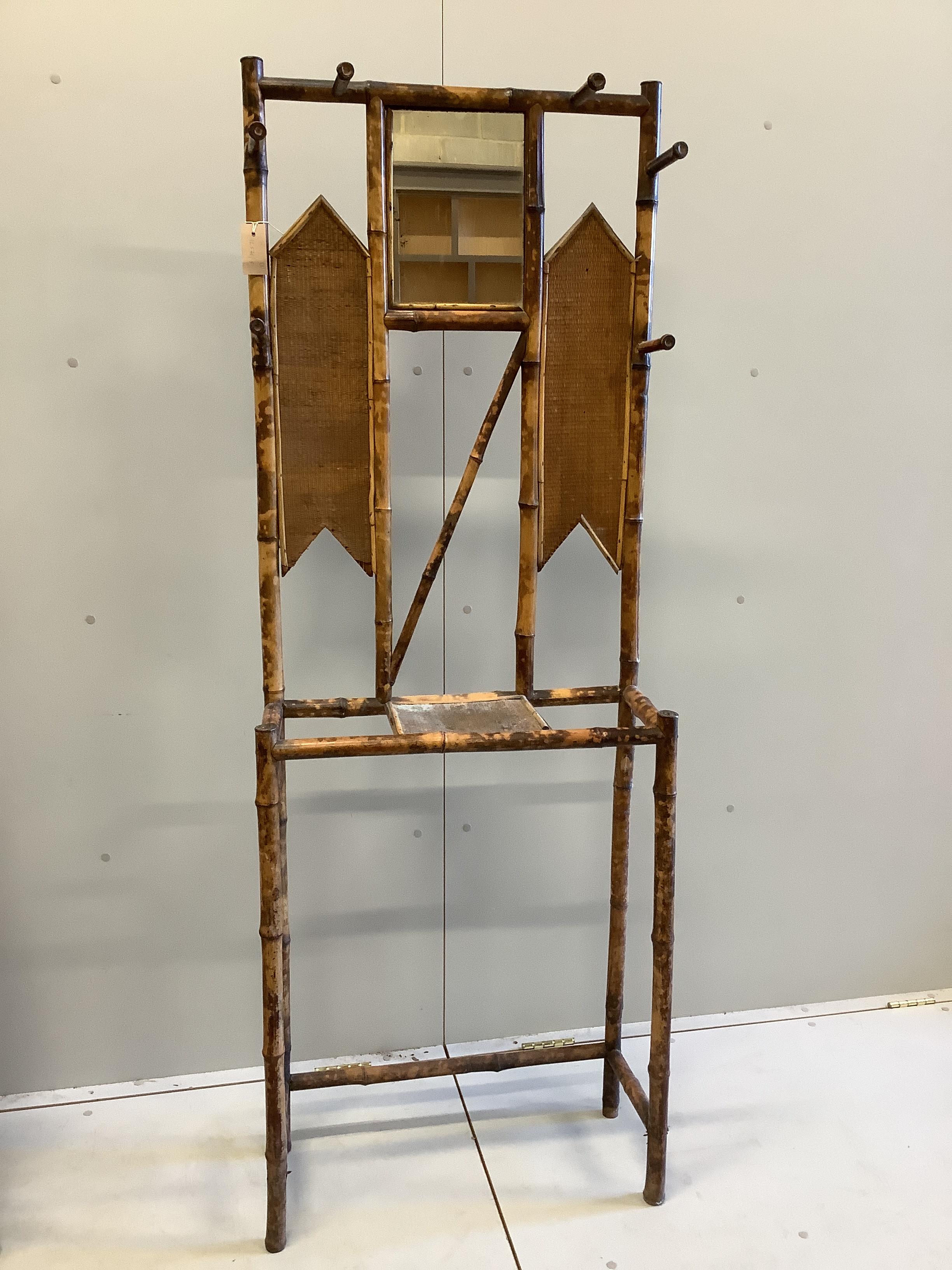 Two late Victorian bamboo hallstands and a bamboo wall mirror, largest width 120cm, height 186cm